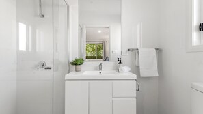 Shower, hair dryer, towels
