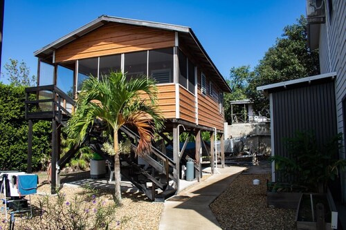 This charming two-bedroom cabana invites you to unwind in a serene escape.