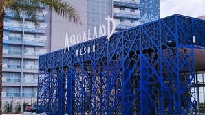 The exterior of Aqualand Resort with a distinctive blue architectural design and a sign indicating the name. - Aqualand Resort (Salinópolis)