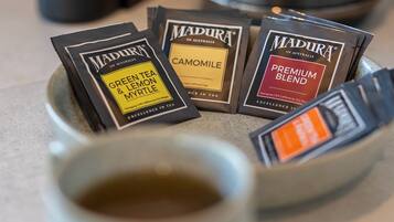 A collection of tea bags in a ceramic cup.
