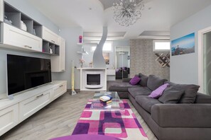 Luxury Apartment, Balcony, Partial Sea View | Living area | 50-inch Smart TV with digital channels, Netflix, streaming services - Partenope (Piano di Sorrento)