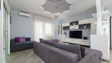 Luxury Apartment, Balcony, Partial Sea View | Living area | 50-inch Smart TV with digital channels, Netflix, streaming services
