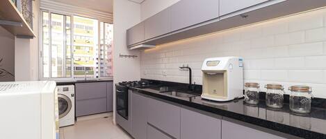 Fridge, microwave, coffee/tea maker, cookware/dishes/utensils