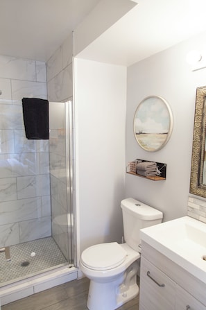 Shower, hair dryer, towels, soap