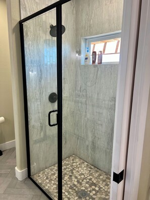 Shower, hair dryer, towels, soap