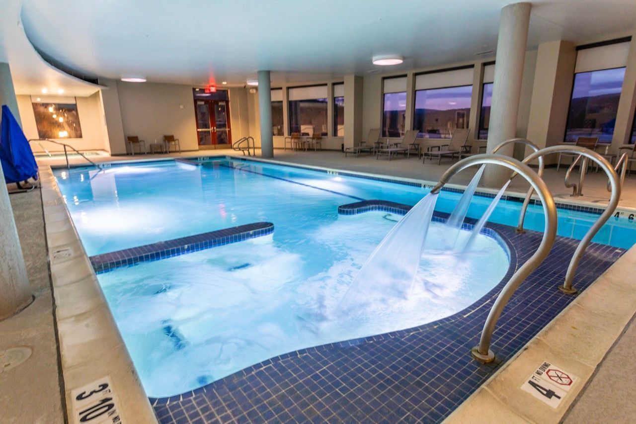 Dive into comfort in a heated indoor pool, surrounded by cozy mountain charm.