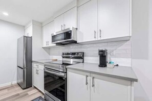 Fridge, microwave, oven, stovetop - Pristine 1 bedroom basement (Calgary)