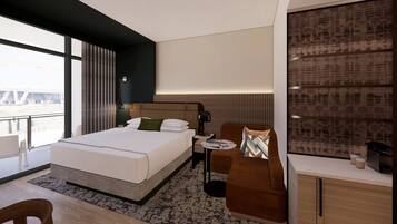 A modern hotel room with a large bed, a small sofa, a desk, and a view of the cityscape.