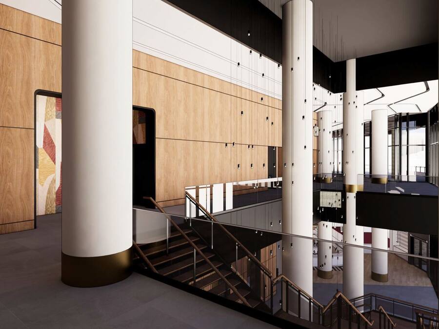 A modern interior with a staircase, wooden panel walls, and a view of the upper floor.