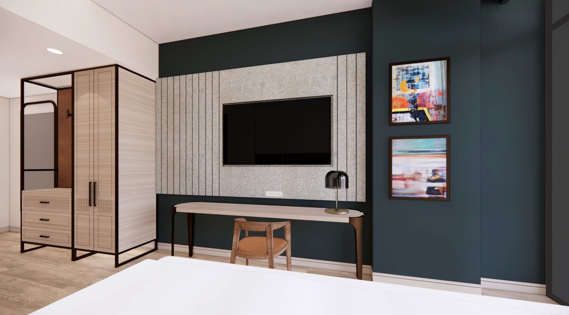 A modern bedroom with a large wardrobe, a desk, and a chair. There is a TV mounted on the wall and two framed artworks.
