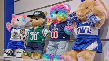 Plush toys on a shelf.