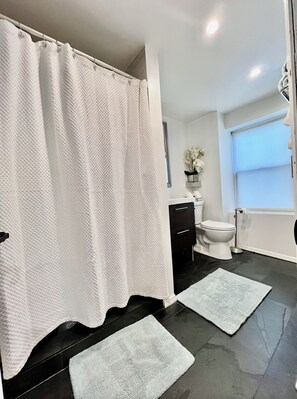 Shower, hair dryer, towels, soap