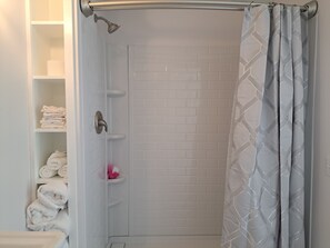 Shower, towels, soap, toilet paper