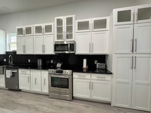 Fridge, microwave, oven, stovetop - Fiesta House  3-bedroom house in Historic Downtown San Antonio (San Antonio)
