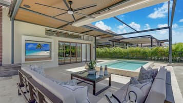 Deluxe Villa, Patio, Pool View | Living area | 55-inch plasma TV with cable channels