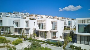 A modern residential area with contemporary architecture, featuring a mix of balconies and terraces.
