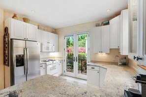 Signature Condo, 1 King Bed, Patio | Private kitchen | Fridge, microwave, oven, stovetop