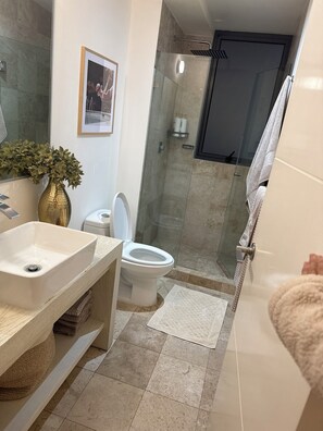 Shower, hair dryer, towels, soap