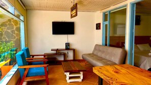 Traditional Apartment | Living area | TV - Aparta Hotel Los Tucanes (Villa de Leyva)