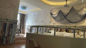 A modern interior with a map on the wall, a coffee station, and a unique ceiling design. - Laisili Hotel (Shanghai)