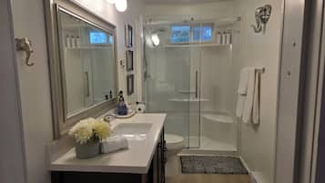 Shower, hair dryer, towels, soap