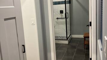 Shower, towels, soap, toilet paper