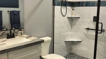 Shower, towels, soap, toilet paper