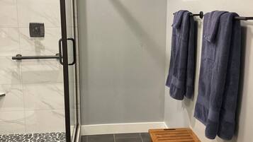 Shower, towels, soap, toilet paper