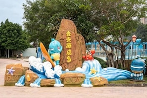 A rock formation with a blue creature and a red creature.