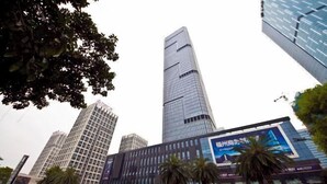 A modern urban area with high-rise buildings, including a prominent skyscraper. - Jinfan City Hotel (Fuzhou)