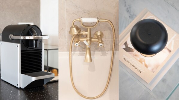 A modern kitchen with a built-in espresso machine, a gold-colored shower with multiple controls, and a black coffee grinder on the counter. - Senorio de Aloha (Marbella)