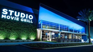 A building with a sign reading "STUDIO MOVIE GRILL."