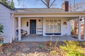 A house with a porch, a blue door, and a window. - Unwind Fireside & Walk to Dtwn! Tyron Retreat (Tryon)