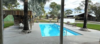 Private & Gated 4-bedroom house with 10.6 Acres, Game Rooms, Pool, Hot Tub, Bar