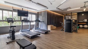 A modern gym with treadmills, a stationary bike, and weight equipment. - Alle 320 in S o Paulo (São Paulo)
