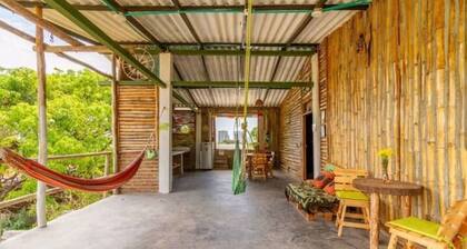 Bedroom with air conditioning and private bathroom near the beach.