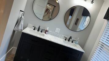 Shower, hair dryer, towels, toilet paper