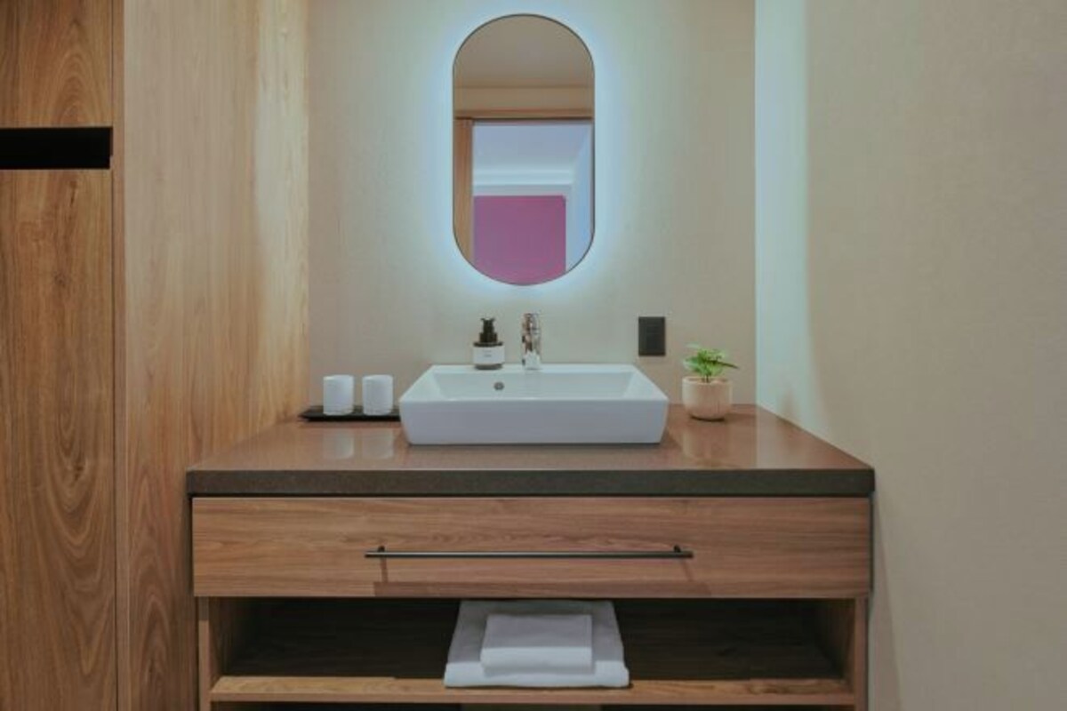 Separate tub and shower, free toiletries, hair dryer, slippers
