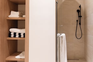 Shower, towels, soap, toilet paper