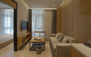 Suite, 1 chambre | Coin séjour