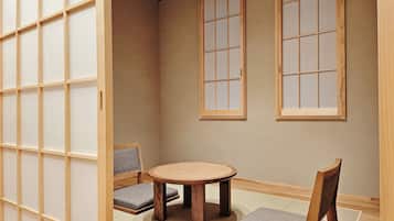 Superior Quadruple Room | Living area | 43-inch LED TV with cable channels, Netflix, streaming services