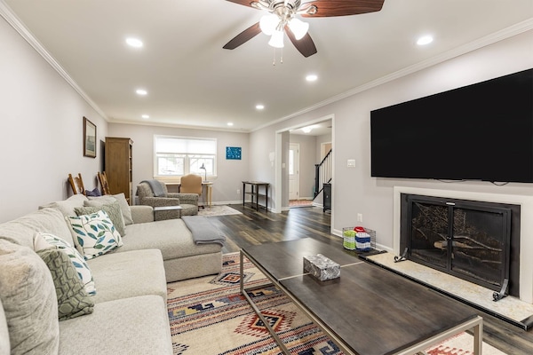 Welcome to Song of River City! The spacious living room doubles as a study.