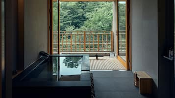 Standard Suite with Stone Bath B type , Dining | Bathroom | Combined shower/tub, rainfall showerhead, eco-friendly toiletries