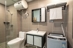 Shower, hair dryer, towels, shampoo