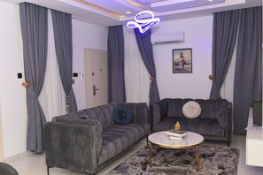 Presidential Apartment | Living area | 50-inch Smart TV with cable channels
