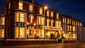 A Victorian-style hotel with multiple stories, large windows, and a prominent sign reading "The Gresham Hotel." - Gresham Hotel Blackpool (Blackpool)