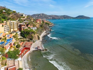 Enjoy ocean views from our villas and apartments, situated near a well-maintained beach with a lifeguard station.