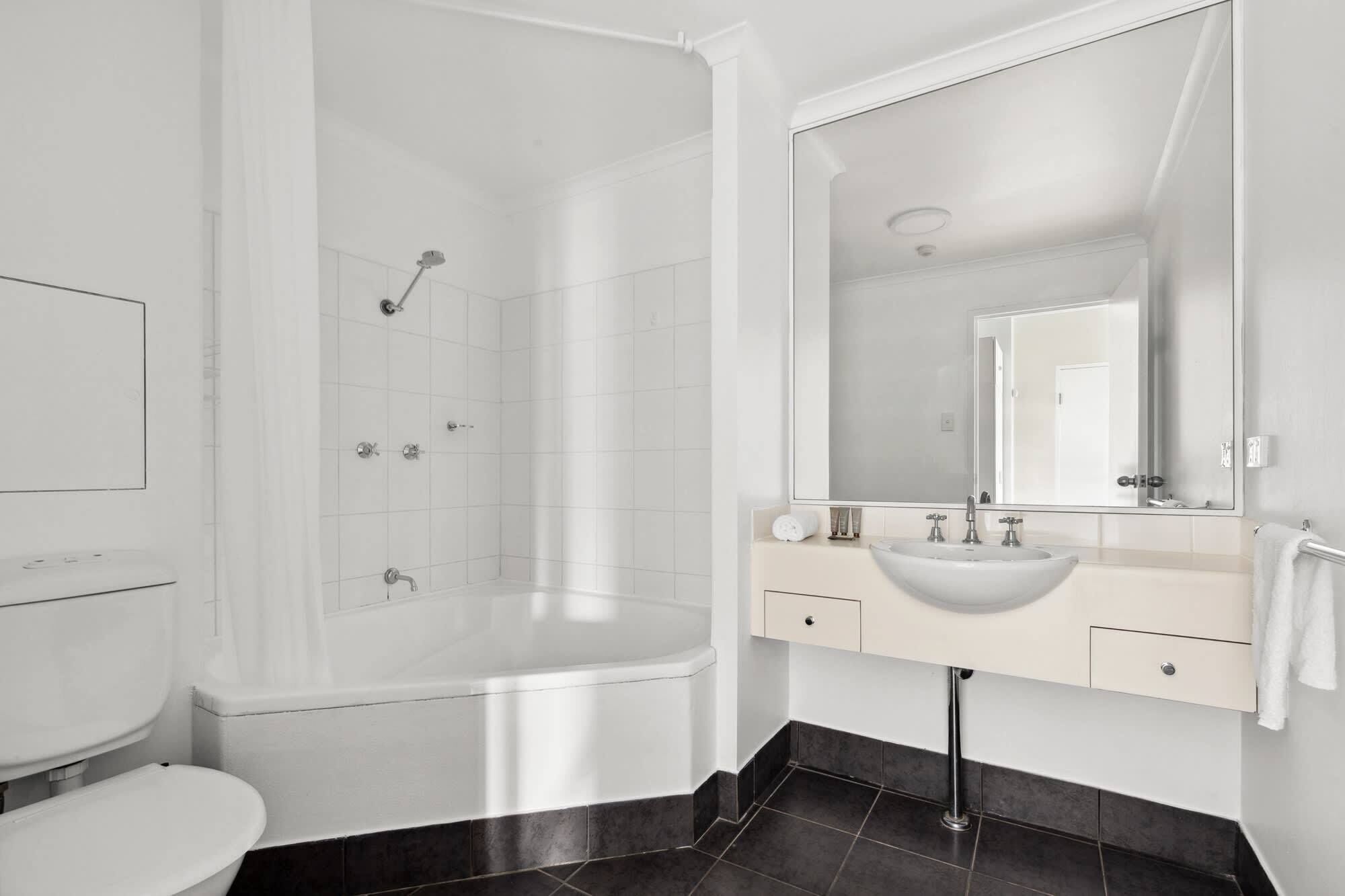 Shower, hair dryer, towels, shampoo