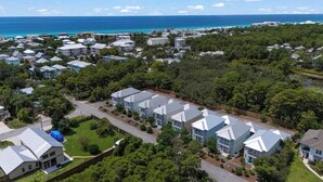 A residential area with houses, a road, and a view of the ocean. - Private Pool + 6  ppl Golf Cart - Blue Mtn. Beach (Santa Rosa Beach)
