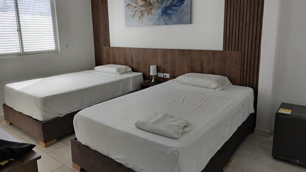Comfort Quadruple Room | In-room safe, desk, laptop workspace, iron/ironing board (on request) - HOTEL BOUTIQUE LOS REYES (Acacias)